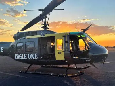 Huey helicopter at sunset
